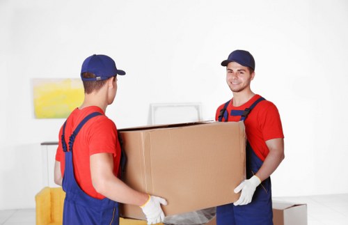 Local removal crew handling furniture for a residential move in north London