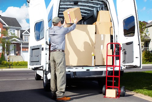 Removal team loading household items into a moving van
