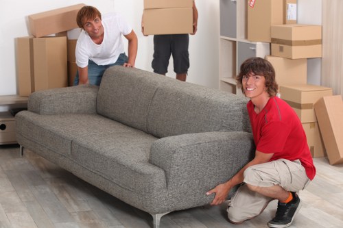 Team moving desks and storage through an office building