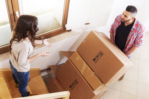 Removal workers securing items and checking site safety